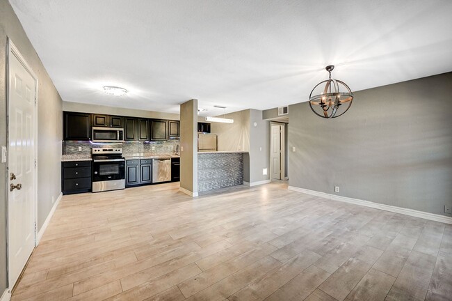 Building Photo - GATED COMMUNITY CONDO WITH BRAND NEW UPGRADES THROUGHOUT