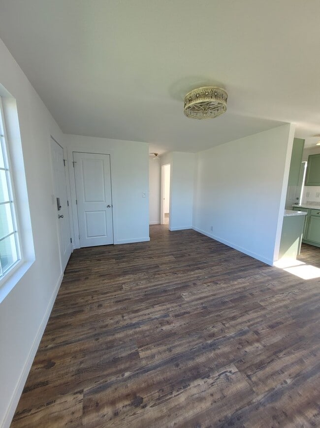 Building Photo - Free May rent with 1 Year Lease - Fully Remodeled with Garage & Yard Care Included