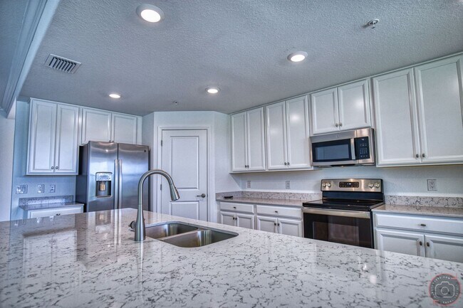 Building Photo - Annual Unfurnished Rental – New Construction Coach Home 3 Bedrooms, 2 Baths, 2 Car Garage, with R...