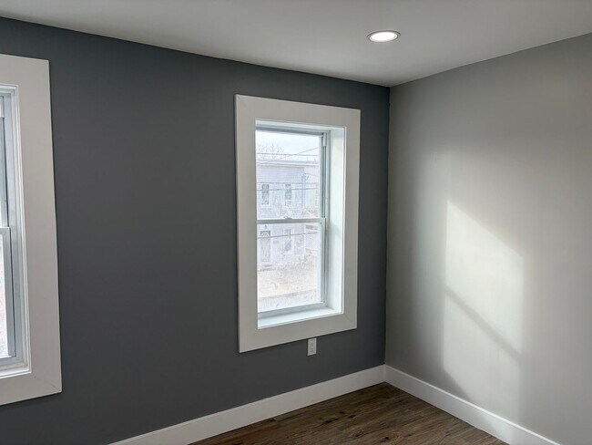 Building Photo - Newly Renovated 2- Story Townhome with Front Porch and Back Yard