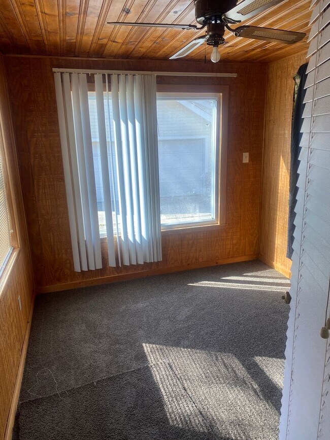 Building Photo - Three bedroom 1 bath bungalow with finished basement and 2 car garage