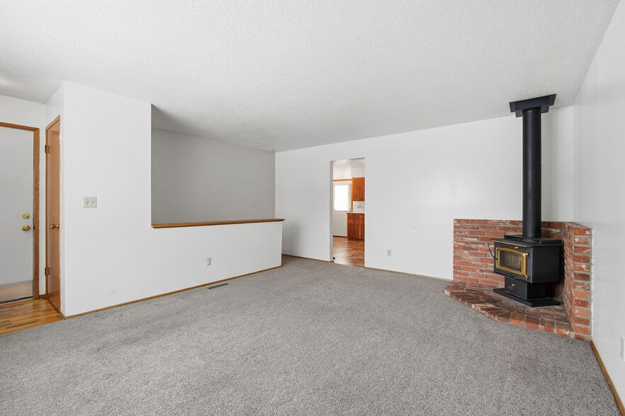 Wood Stove in Living Room - 12202 E 10th Ave