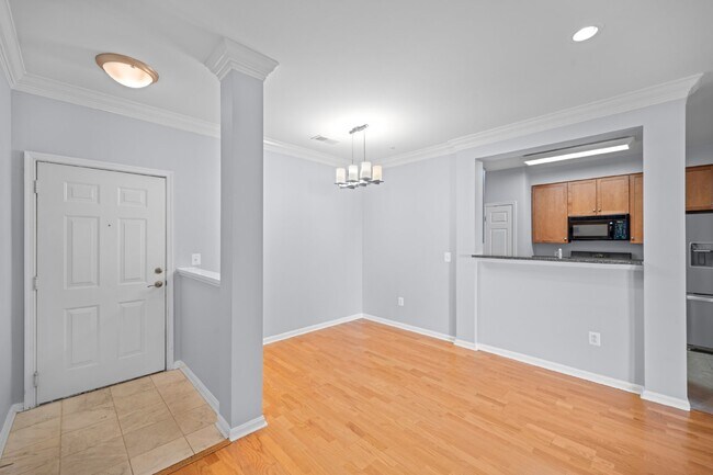 Building Photo - Two-bedroom, two-bathroom model with a den, located on the third floor.