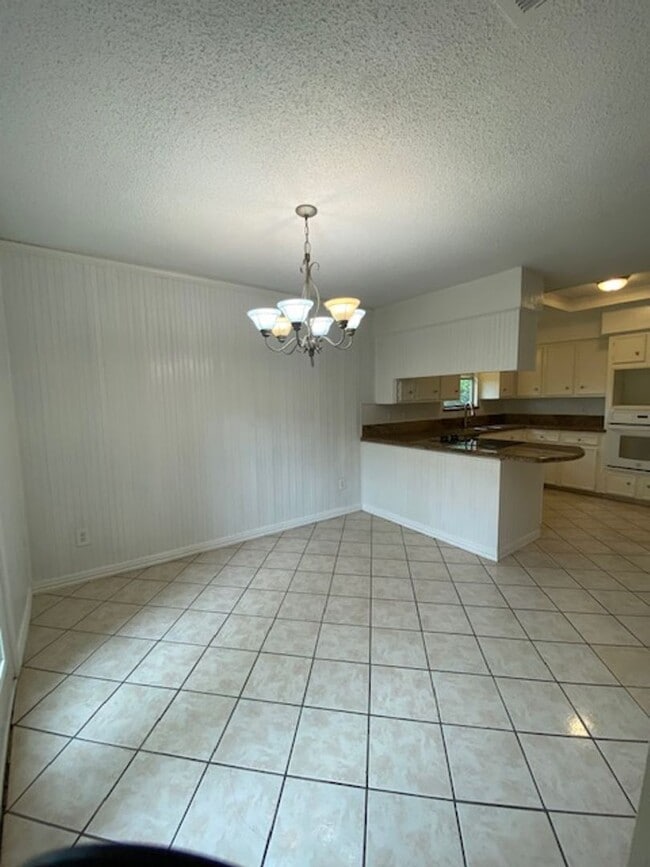 Building Photo - Come and view this open floor plan with much potential. Formal and dining room, granite counters,...