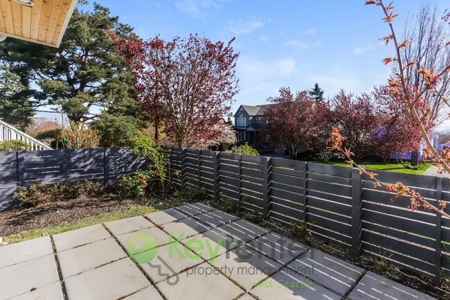 Building Photo - Spacious Living with Balconies, Deck, and Private Yard