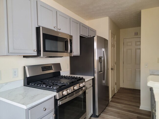 Building Photo - Lake Front Property. Loft - Swim/Tennis - Stainless Steel Appliances