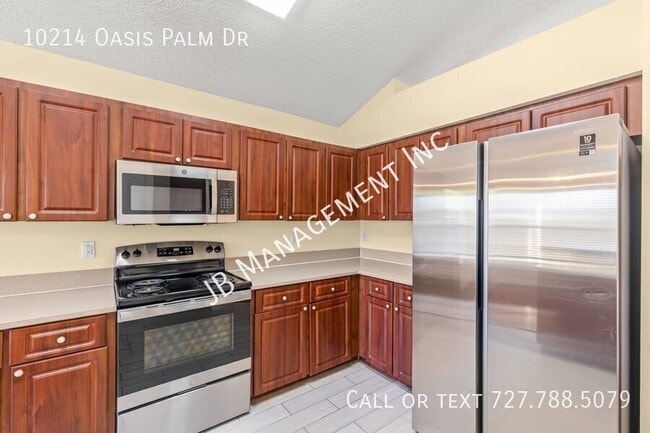 Building Photo - 10214 Oasis Palm Dr