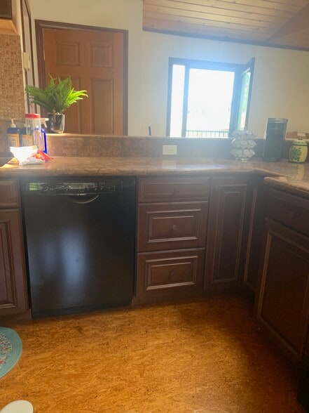 Dishwasher and drawers full of kitchen supplies - 14715 Greenleaf St