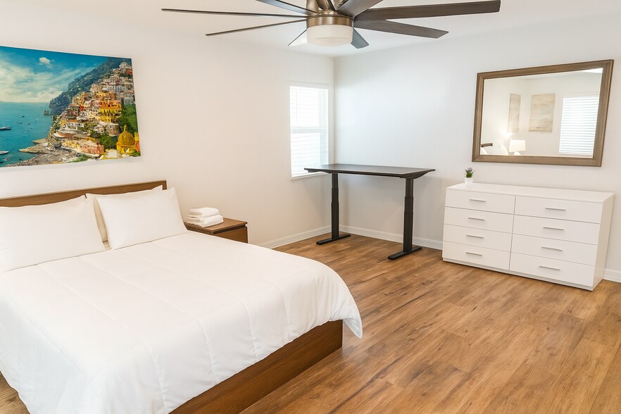 Spacious master bedroom with comfy queen bed and 58” 4K Smart TV. - 10116 Mercedes St