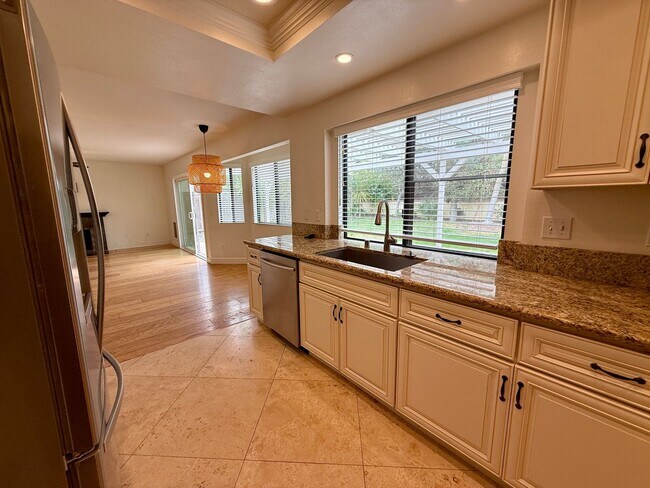 Building Photo - Spacious 4 Bedroom House with Large Fenced Yard! Landscaping Included! Two Car Garage!