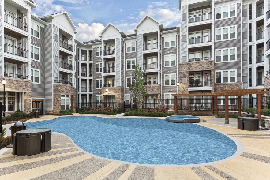 Resort-Style Swimming Pool With Expansive Tanning Areas - The Sutton Apartments