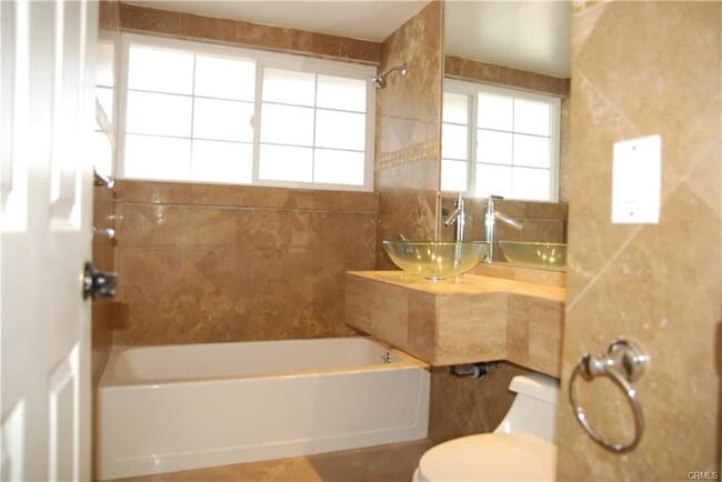 Building Photo - 6744 Cozycroft Ave