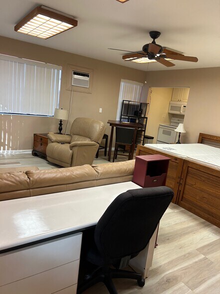 view from front door, desk with office chair - 630 NW 7th Ave