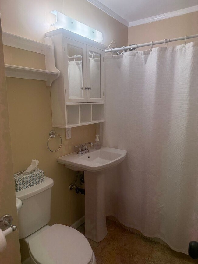 Building Photo - Step into this beautifully updated 1950's gem, where charm meets modern convenience