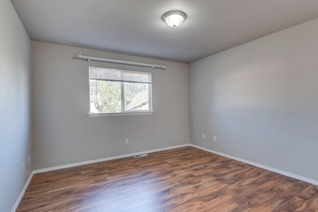 Building Photo - Spacious 4-Bedroom Home with Cozy Backyard...