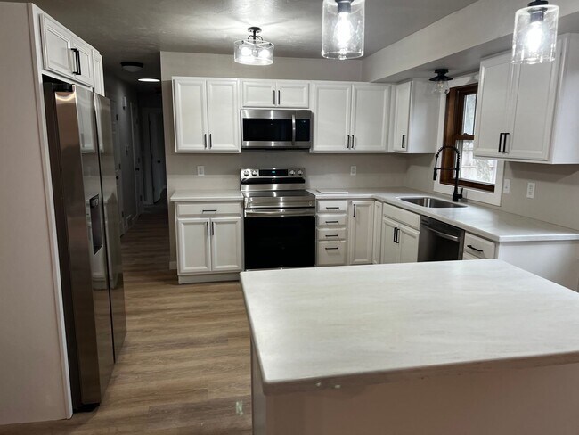 Building Photo - Spacious 4-Bedroom Home with Finished Basement & Garage