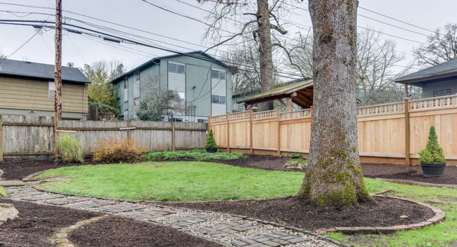 Building Photo - Charming 2 Bedroom 1 Bathroom Bungalow with Oversized 1 Car Garage and Large Manicured  Backyard ...