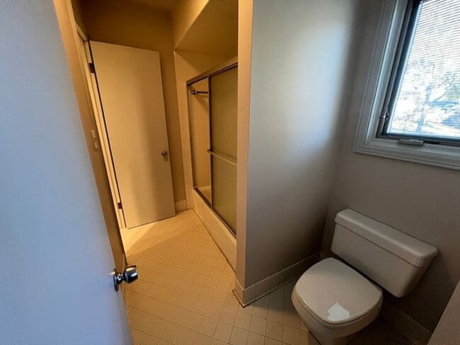 Building Photo - Step into this inviting, sunlit home where space and comfort blend seamlessly