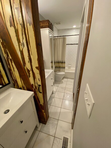Bathroom 1 and 2 showing barn door - 1406 Andre St