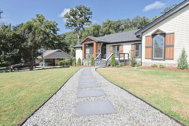 Building Photo - COMING SOON · Designer Renovation · Covered Deck Pavilion · 2-Car Garage · Lawn Care Included