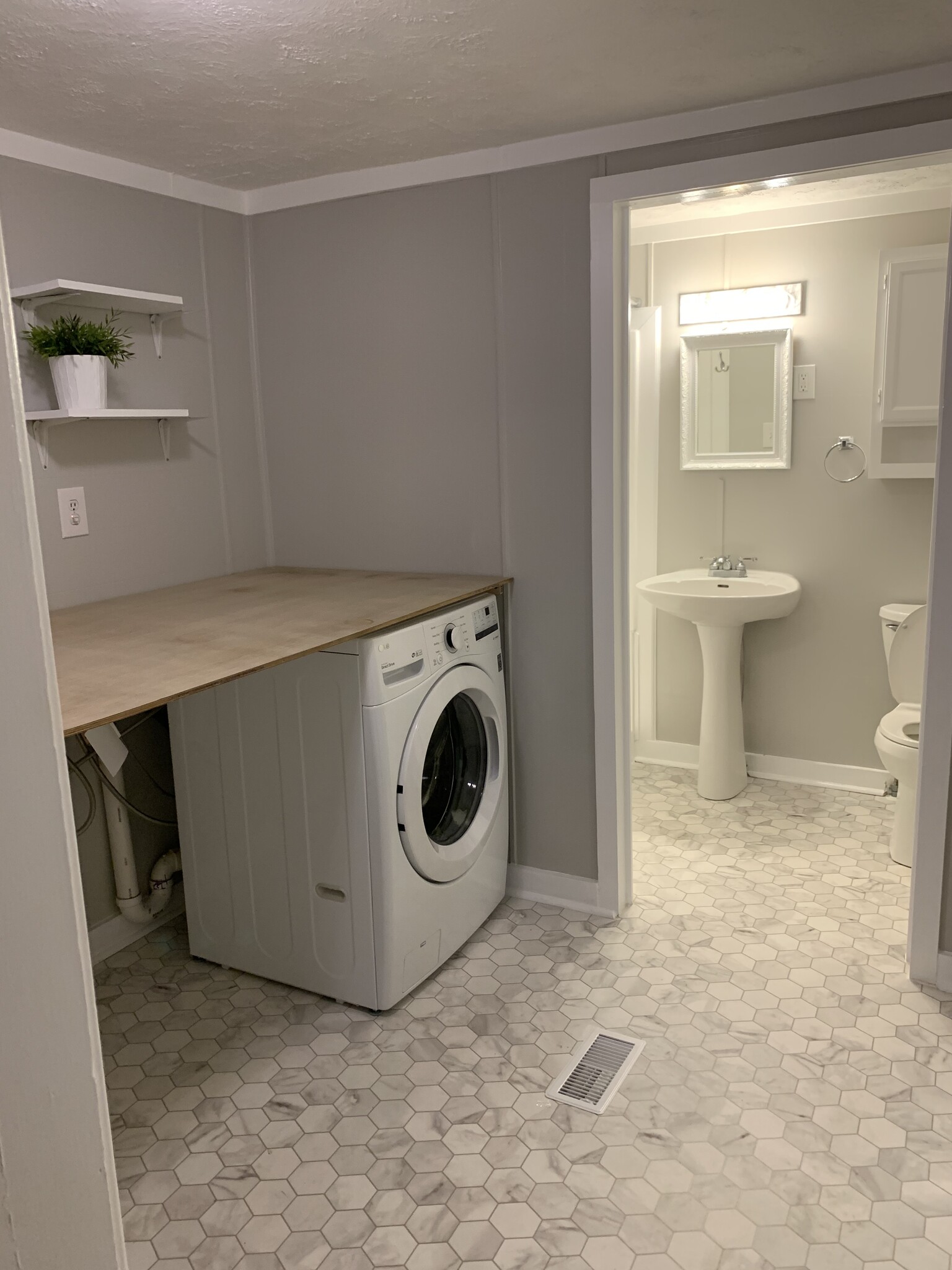 Laundry room with washer/dryer hookup (connects to bathroom, den, & 1st floor bedroom) - 166 Montague St