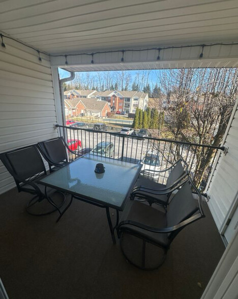 Balcony overlooking parking lot/pool area - 750 Hidden Ridge Ct