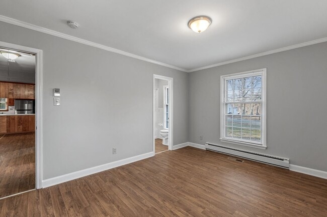 Building Photo - Large Brick Ranch, New Wood Like Flooring Throughout, Just Painted, LR, Den, Sun Room, Carport!