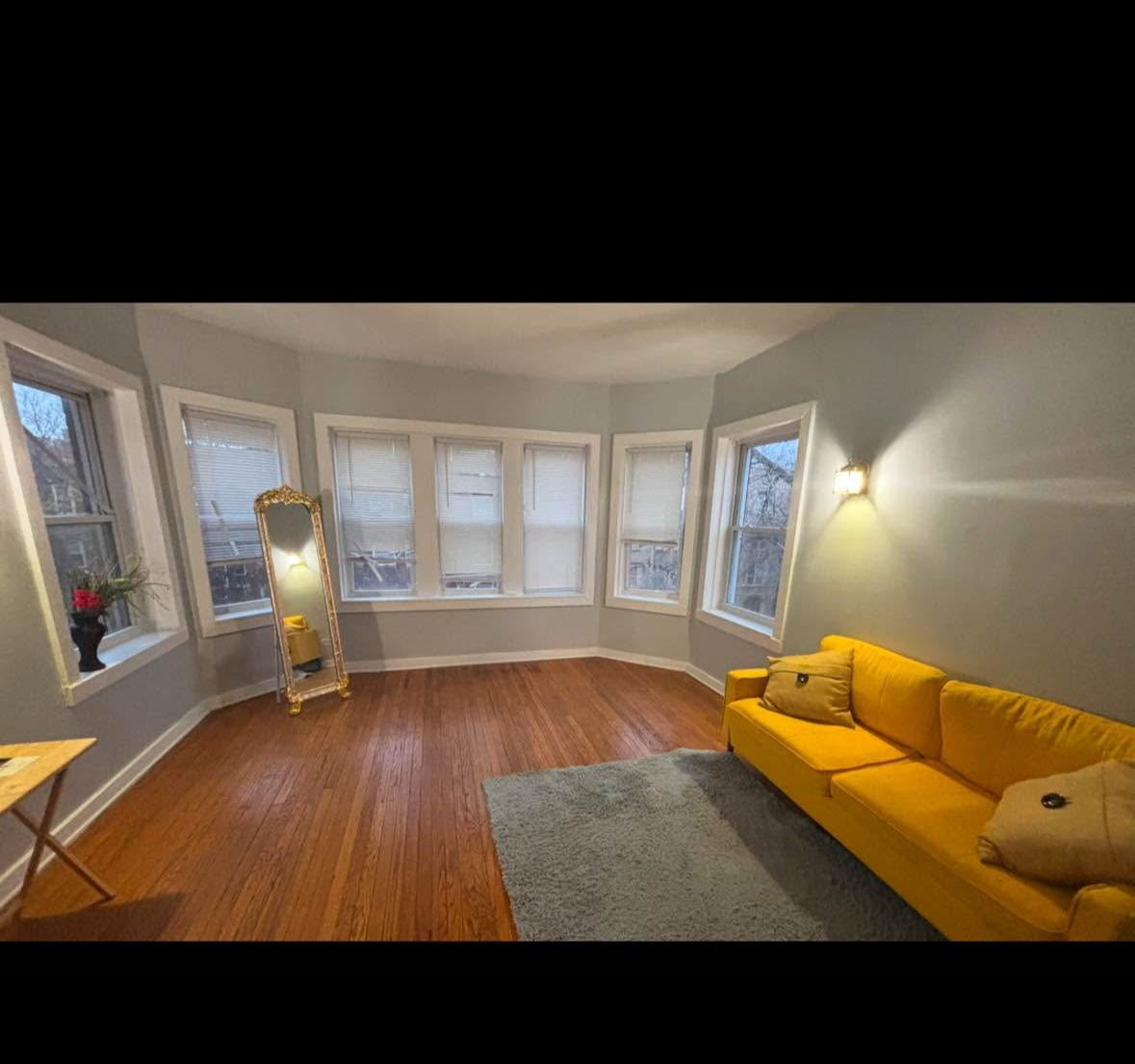 Large living area space with hard floors - 8046 S Maryland Ave