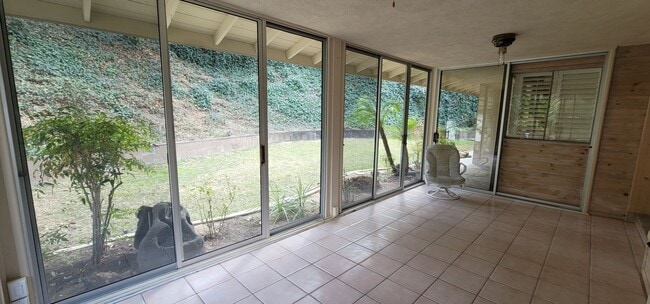 Building Photo - Classic, Midcentury 3 bedroom with Den, 2.5 bath home nestled into hillside with secluded backyar...
