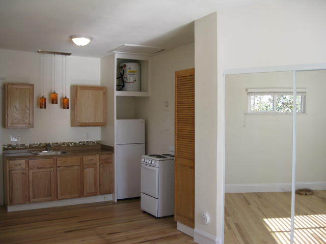 Kitchen shows pantry, oven and refrigerator - 1217 W 15th St