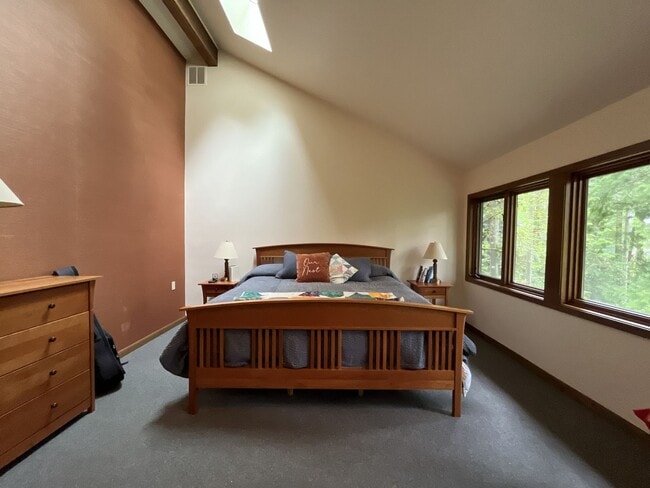 Building Photo - One-of-a-Kind Custom Home with Wall of Windows, Stone Fireplaces, Expansive Entertainment Space &...