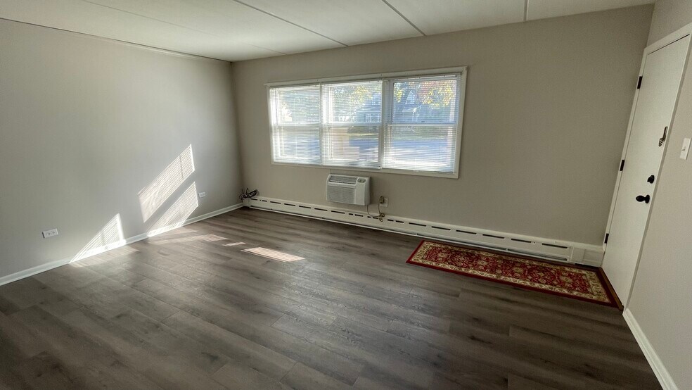3 Full Walls Join To Create The Spacious Living Room W/3 Windows & The Front Door. - 2 N Broadway Ave
