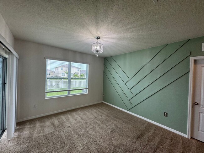 Building Photo - 3BD/2BA Modern Florida Home Living Reimagined — Solar-Powered Elegance Near I-95 in Edgewater! FU...