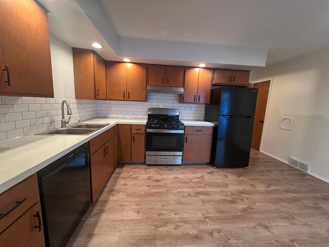 Building Photo - Two Bedroom Duplex SE Side w/ Decorative Fireplace! One Stall in Garage!