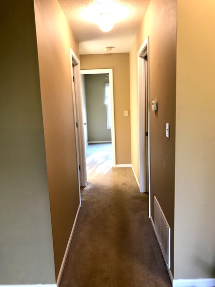 Hallway to bedrooms, bathroom and laundry - 3173 Windcrest Dr NE