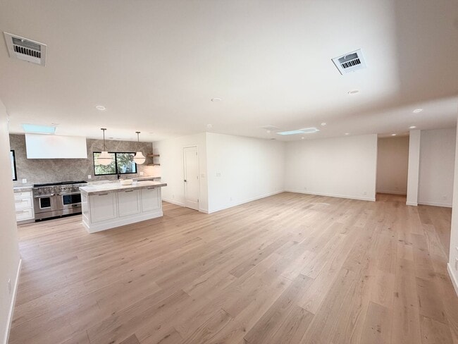Building Photo - This premier 4-bed, 3-bath estate spans 2,565 sq. ft. on a 10,253 sq. ft. lot in North Los Altos.
