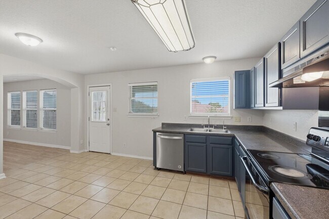 Building Photo - 4BR Home with Open Living Area & Included Appliances
