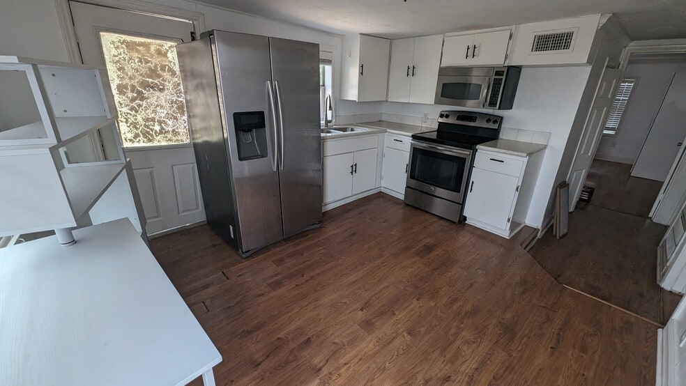 Kitchen refreshed cabinets - 203 Johnson St