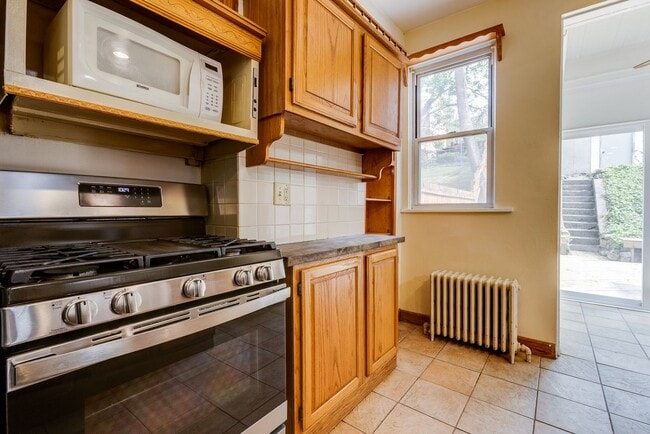 Building Photo - AVAILABLE June 2026 - Beautiful 4 Bedroom, 2 Bath Home w/ Front Porch Swing!