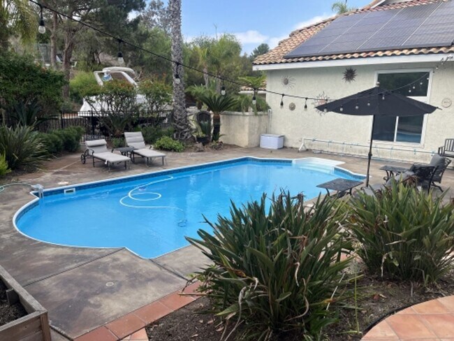 Building Photo - Stunning 4 bedroom Home with a Pool locate...