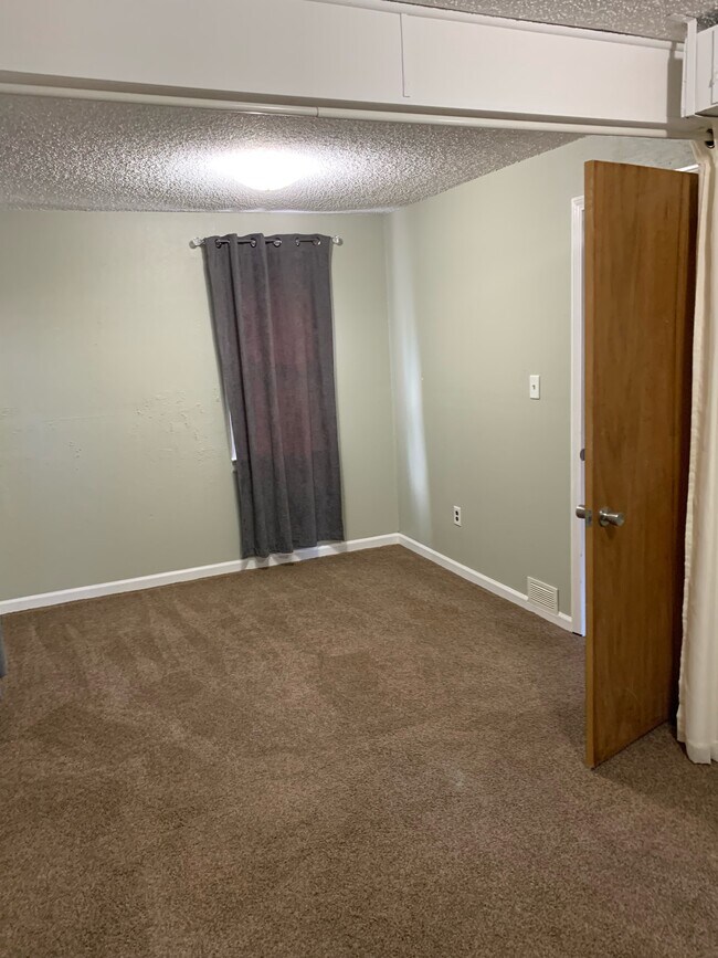 Bedroom at closet looking toward window - 9356 Lamont St