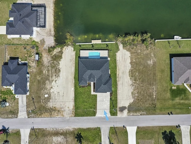 Building Photo - Almost New Construction Waterfront Home in NE Cape Featuring A Pool, Fenced Yard & More! COMING SOON