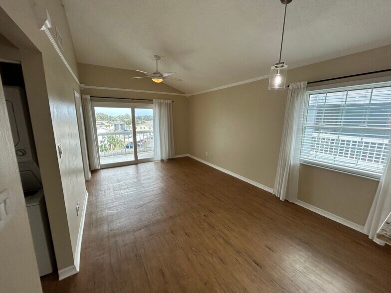 View of living room and balcony from kitchen - 6810 Stones Throw Cir N