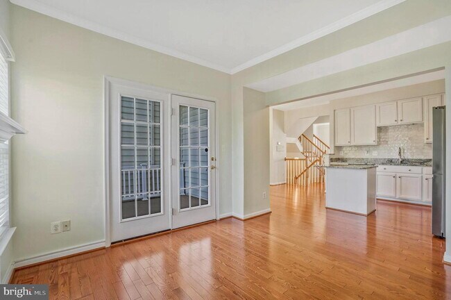 Building Photo - This beautifully maintained brick-front, three-level townhome is located in a highly sought-after...