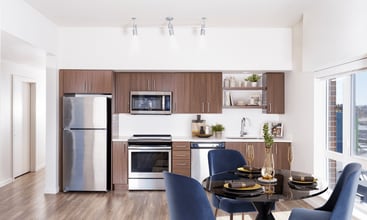 A bright, streamlined kitchen at Modera Belmont, offering modern finishes and an easy flow just steps from Belmont’s shops, dining, and neighborhood staples. - Modera Belmont