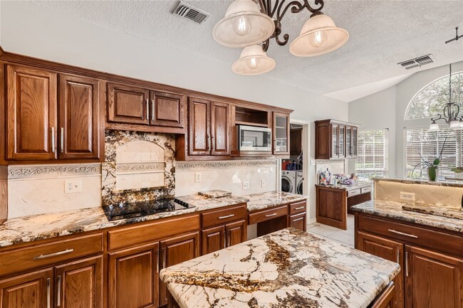 Building Photo - Stunning Home in Guard Gated Community ~ I...