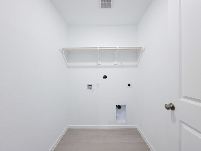 Building Photo - This great new single-story design makes smart use of the space available. At the front are all t...