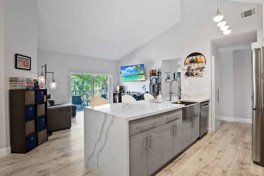 Modern kitchen with stainless steel appliances - 15770 SW 104th Ter