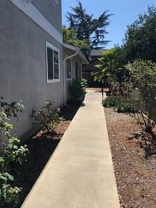 Walkway from front of building with motion detector lights. - 375 N M St
