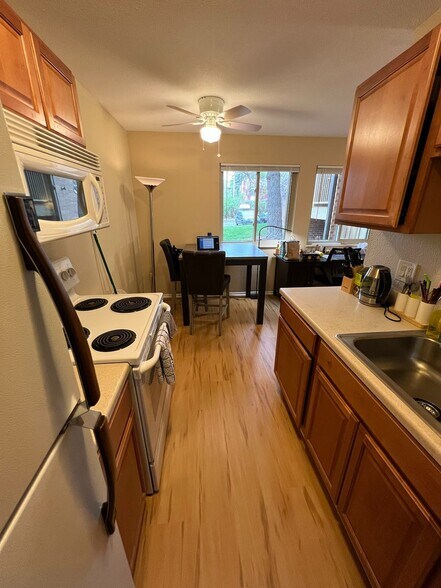Kitchen looking to dining area and windows - 3393 Madison Ave